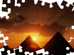Pyramids, sun, clouds, west