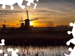 Windmills, sun, grass, west