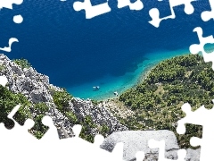 Mountains, rocks, motorboat, sea