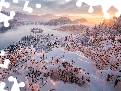 Slovenia, winter, Islet, Lake Bled, trees, rays of the Sun, Bush, Mountains, snow, viewes, Snowy