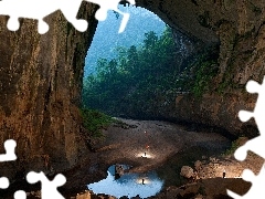 People, rocks, viewes, water, trees, cave