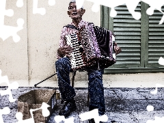 a man, accordion